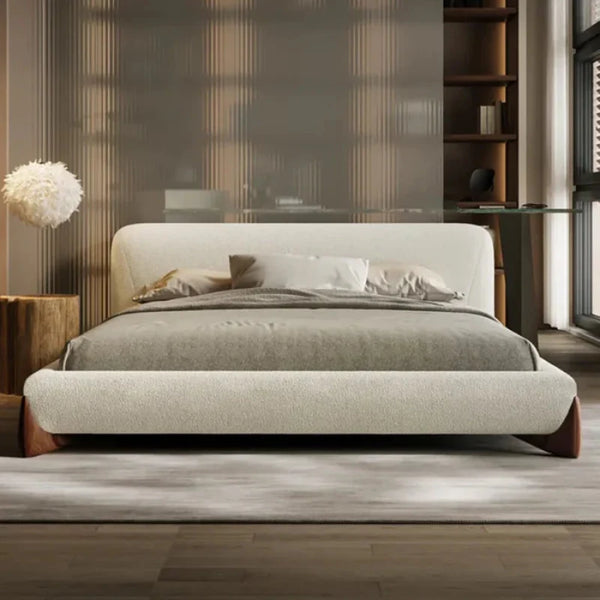 Oak Inside Modern bedroom with a beige upholstered bed, wooden side tables, and a glass desk.